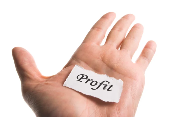 Beneficio palabra en mano, palabra en pedazo de papel lacrimógeno —  Fotos de Stock