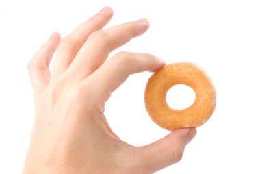 Lovely mini donut in man's hand clipart