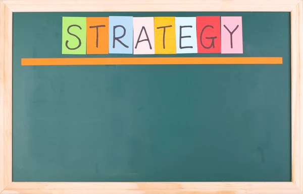 Strategie, kleurrijke woord op lege schoolbord — Stockfoto