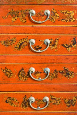 Old Chinese cabinet with traditional painting clipart