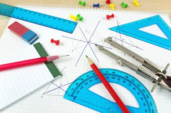 Geometry equipment on writing desk — Stock Photo, Image