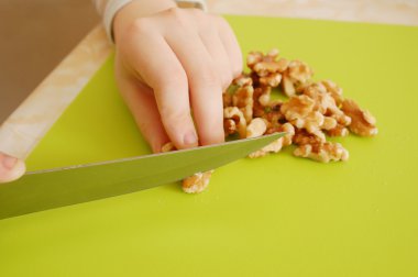 Cutting a walnuts clipart