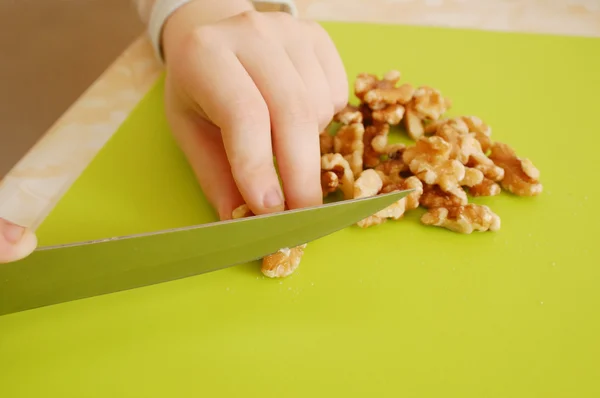 Cutting a walnuts — Stock Photo, Image