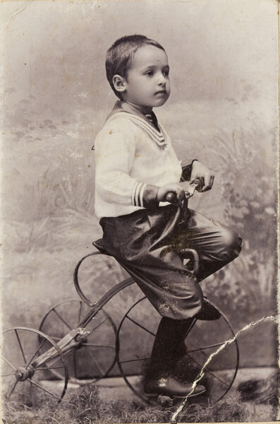 A little boy on a bicycle