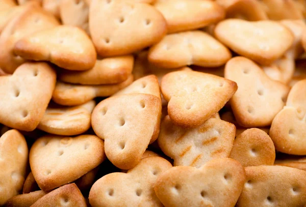 Background of salted heart shaped crackers — Stock Photo, Image