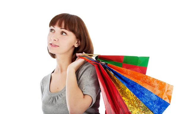 Renkli Alışveriş Torbaları Üzerinde Beyaz Izole Dalgın Genç Kadın — Stok fotoğraf