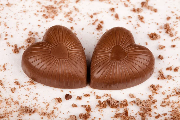Two Chocolate Hearts Crumbs White Background — Stock Photo, Image