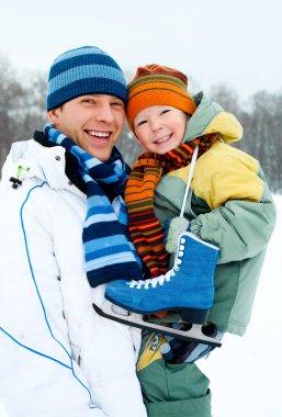 Father and son go ice skating clipart