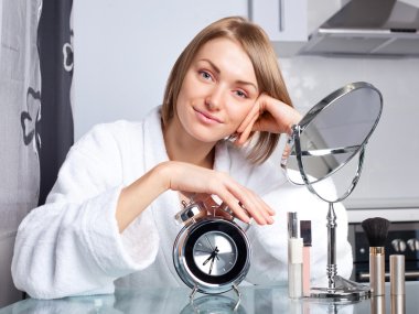 Woman applying makeup clipart