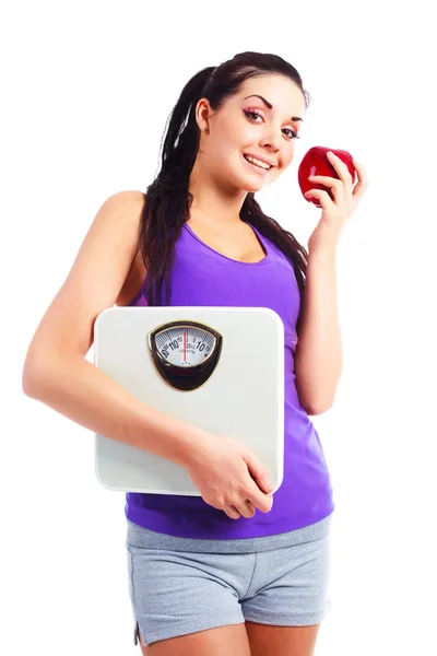 Девушка с чешуей и яблоком — стоковое фото