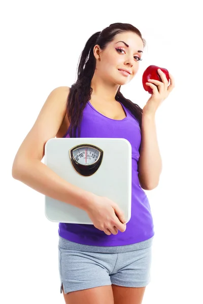 体重秤和苹果的女孩 — 图库照片