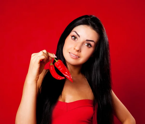Girl with peppers — Stock Photo, Image