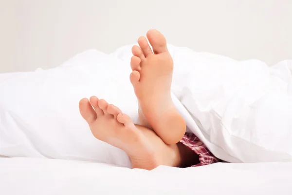 Füße einer schlafenden Frau — Stockfoto