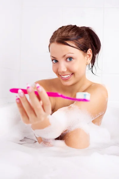 Девушка чистит зубы Лицензионные Стоковые Изображения