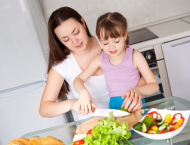 Mother and daughter eat bread clipart