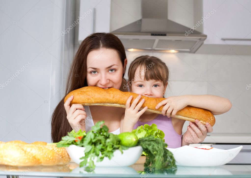 Mother and daughter eat bread — Stock Photo © lanakhvorostova 4313580