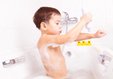 Boy taking a bath clipart