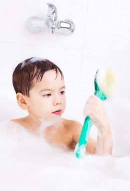 Boy taking a bath clipart