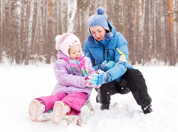 Happy Family Young Mother Her Daughter Sled Having Fun Winter — Stock Photo, Image