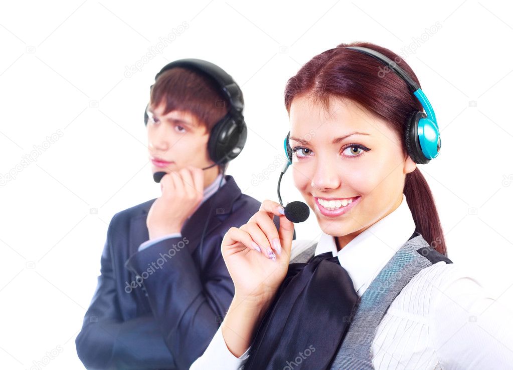 Beautiful woman and a young man working in the call-center (focus on the woman)