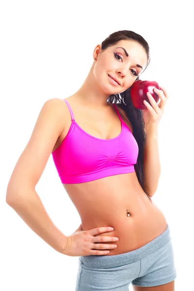 拿一个大的红苹果年轻运动型美女 — 图库照片