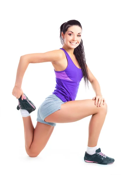 Mooie Jonge Brunette Vrouw Spieren Van Haar Benen Uit Rekken — Stockfoto