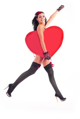 Sexy young jumping woman with a big heart in her hands clipart