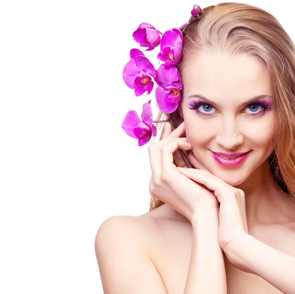 Woman with an orchid — Stock Photo, Image