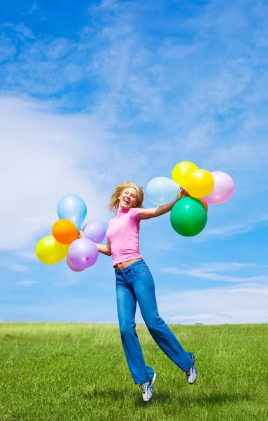 Женщина с воздушными шарами — стоковое фото