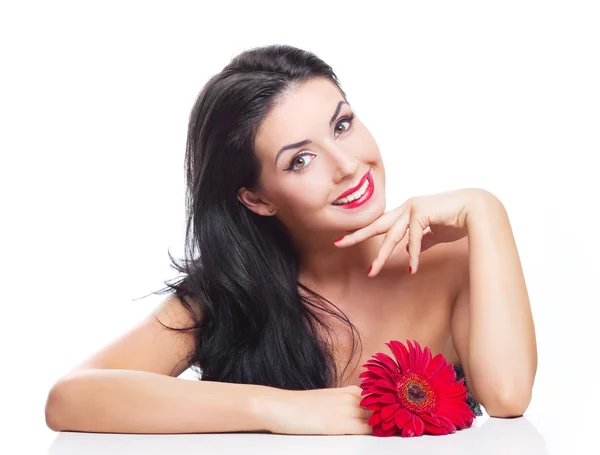 Brünette Frau mit einer Blume — Stockfoto