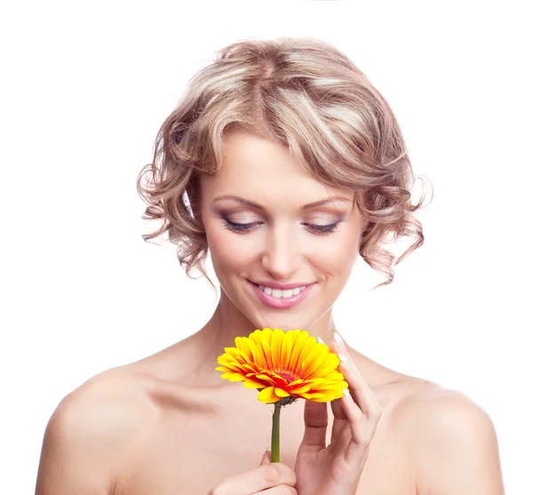 Kvinna med en blomma — Stockfoto