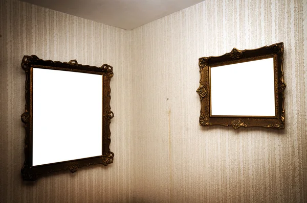 Old frames on retro wall — Stock Photo, Image