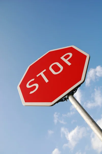 Stop sign against blue sky — Stock Photo, Image