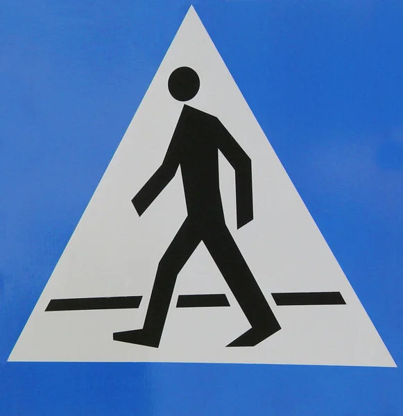 Sinal com homem e travessia de pedestres — Fotografia de Stock