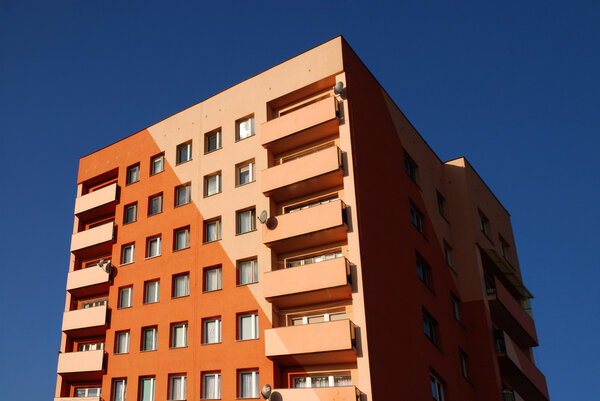 New orange building against a blue sky