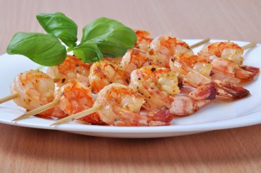 Shish Kebab from Shrimps on dish clipart