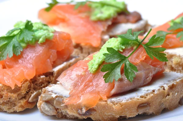 Sandwich with smoked salmon isolated — Stock Photo, Image