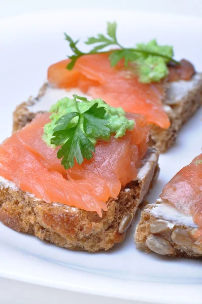 Sandwich with smoked salmon isolated — Stock Photo, Image