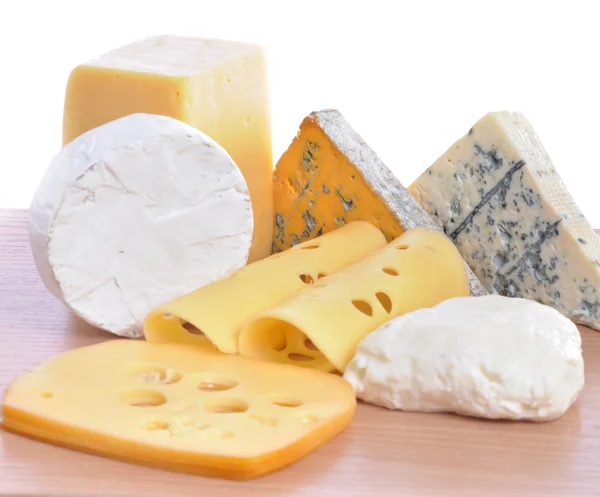 stock image Various types of cheeses isolated