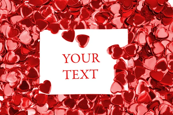 Картка з місцем для тексту на фоні червоних сердець — стокове фото