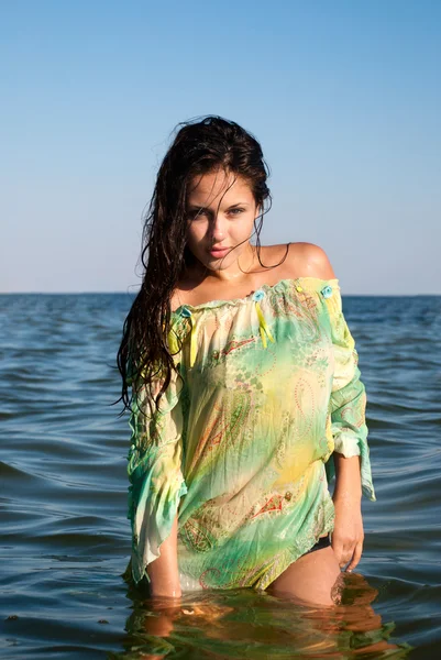 stock image Young woman on the sea in summer