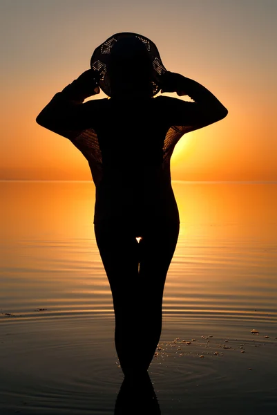 Ocean woman in sunrise light
