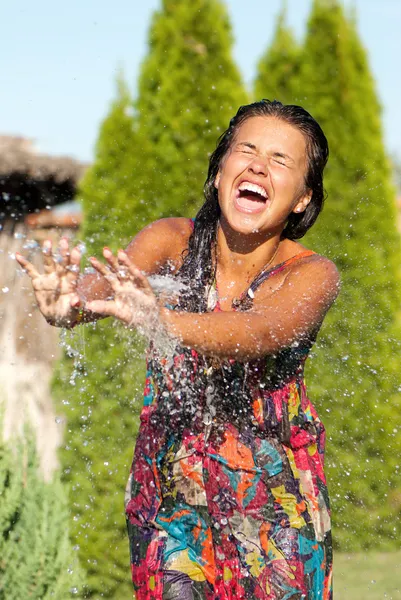 stock image The young girl having a shower bath water