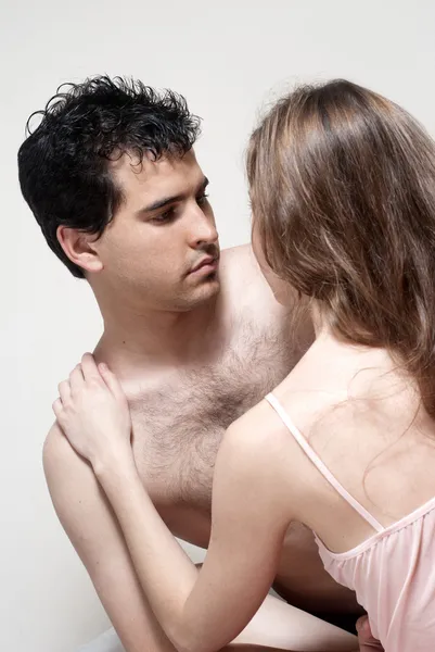 Intimate young couple during foreplay in bed — Stock Photo, Image