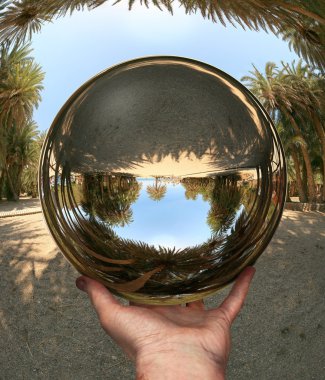 Glass sphere in hand. Vai. Crete clipart