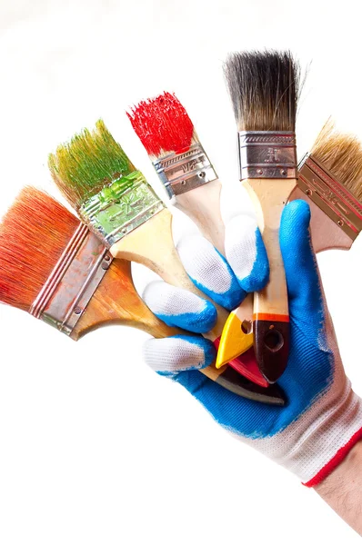 Hand and brushes — Stock Photo, Image