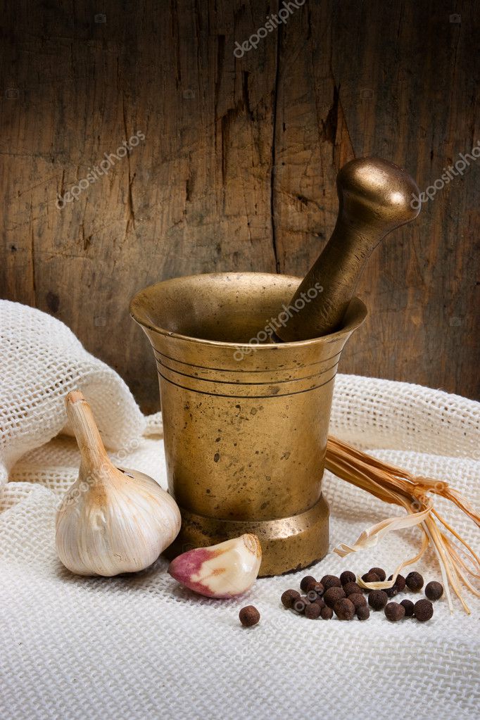 Antique Bronze Mortar Pestle Spice Garlic Bell Pepper White Tablecloth  Stock Photo by ©AlexAvich 4745806