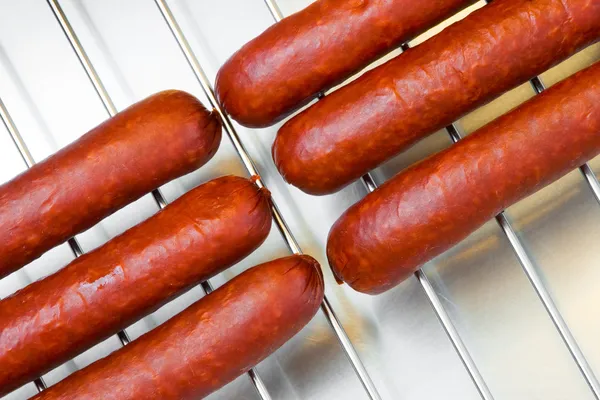 stock image Sausages on barbecue grill