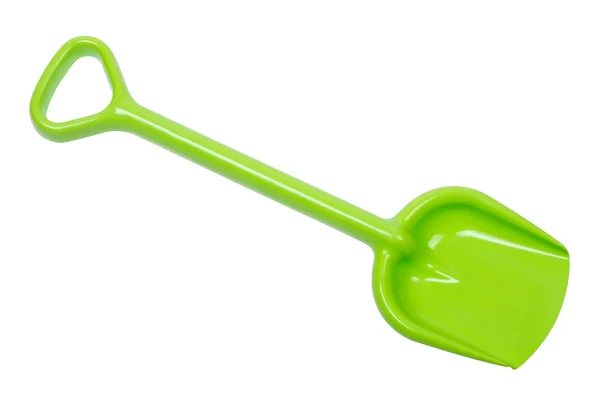 Зеленая игрушечная лопата, изолированная пластиковая лопата — стоковое фото