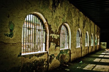 An old deserted jail on a bright sunny day clipart